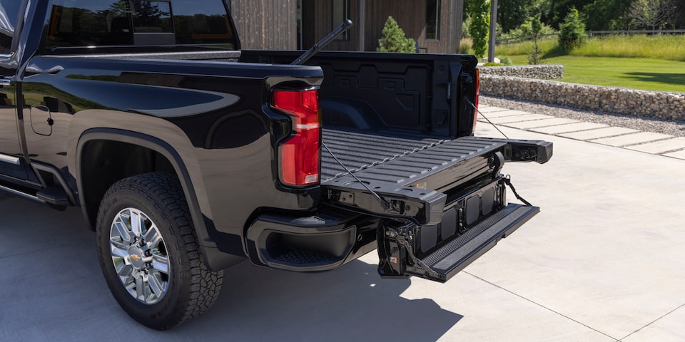 Three Quarters Rear View of a Chevy Silverado HD in Front of a House