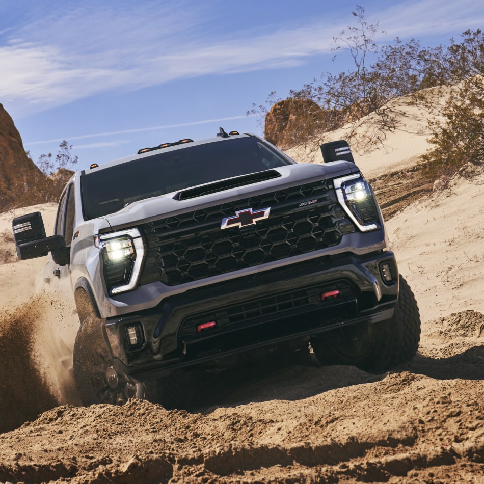 Front View of a Chevy Silverado HD Drifting in a Desert
