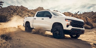 Three Quarters View of a White Silverado under a Sunny Weather on a Desert