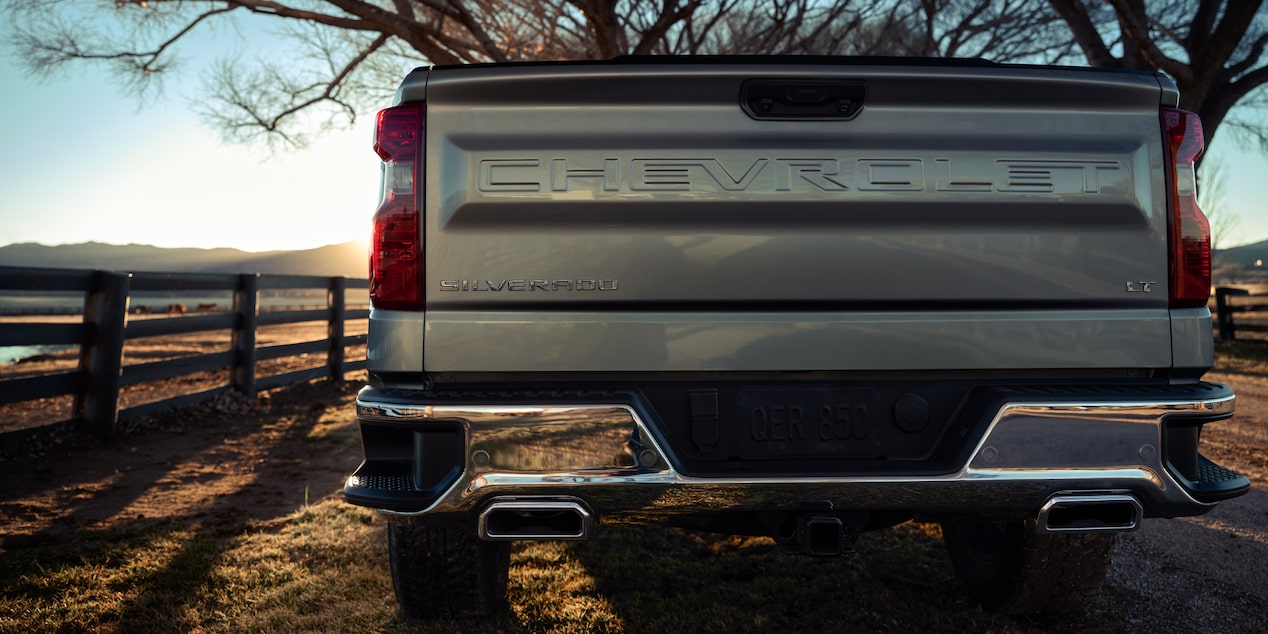 Rear View of a 2025 Chevy Silverado Pickup Truck with a Sunlight Peaking from the Side