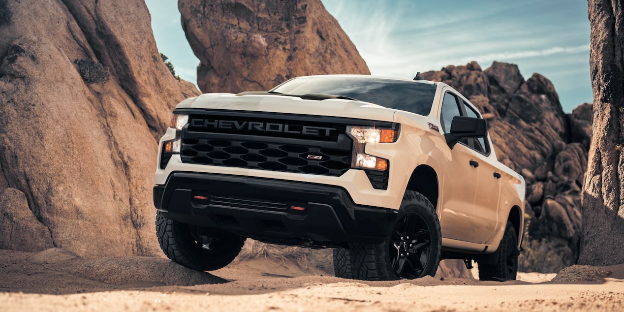 Low Three Quarters View of a 2025 Chevy Silverado Pickup Truck on a Rocky Plain