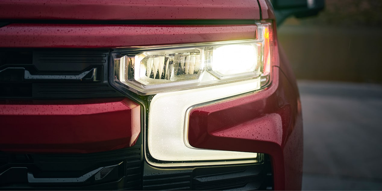 Close-up of the Head Light of a Red 2025 Chevy Silverado Pickup Truck
