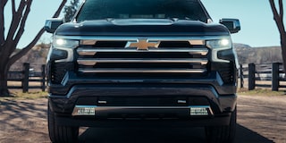 Close-up front view of a black 2025 Chevy Silverado Grille
