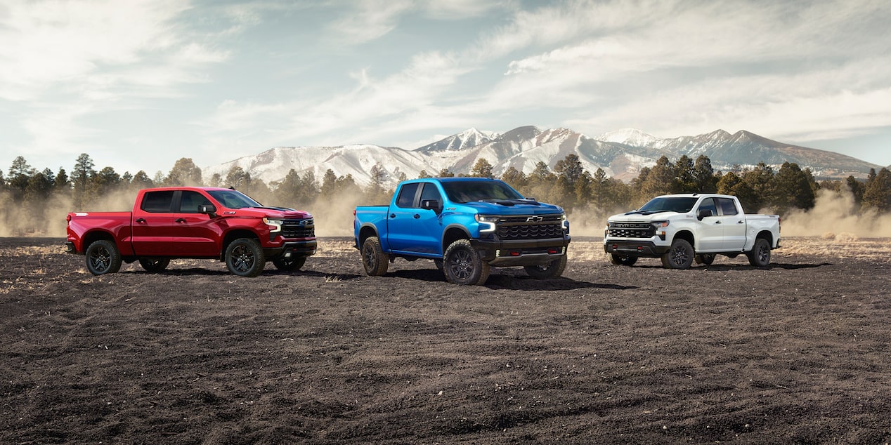 A White Blue and Red Chevy Silverado Pickup Truck on a Rocky Plain