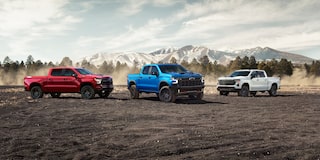 A White Blue and Red Chevy Silverado Pickup Truck on a Rocky Plain