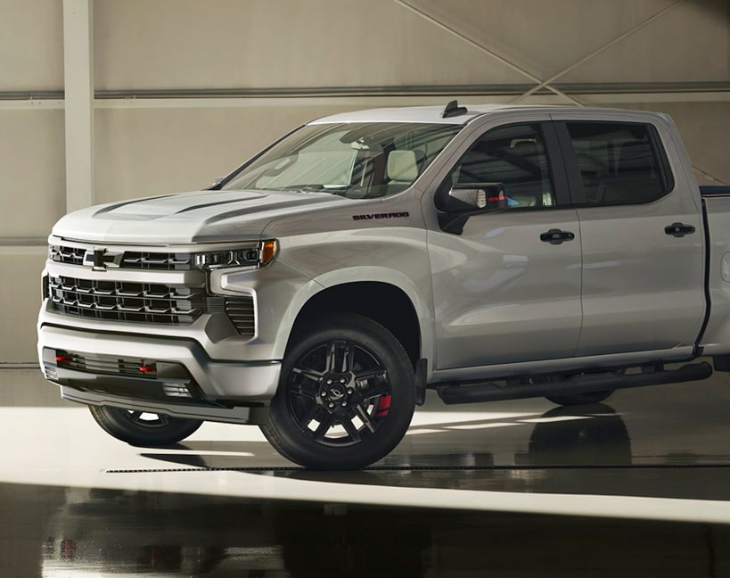 Three Quarters View of a 2025 Grey Chevy Silverado In a Garage