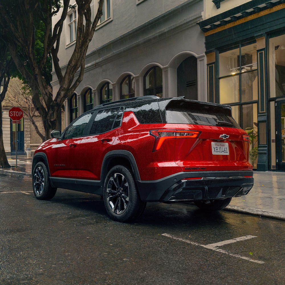 2026 Chevy Equinox Rear End View Parked in Front of Shops