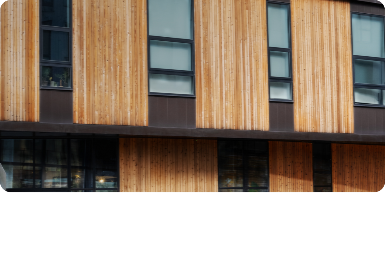 Modern Building With Vertical Wood Paneling and Black-Framed Windows