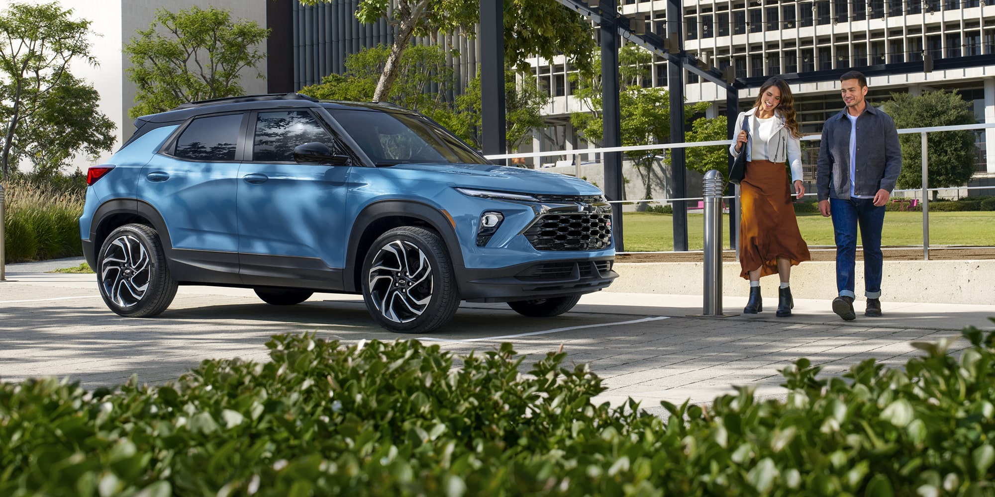 A Couple Walking Up to Their Parked 2026 Chevy Trailblazer