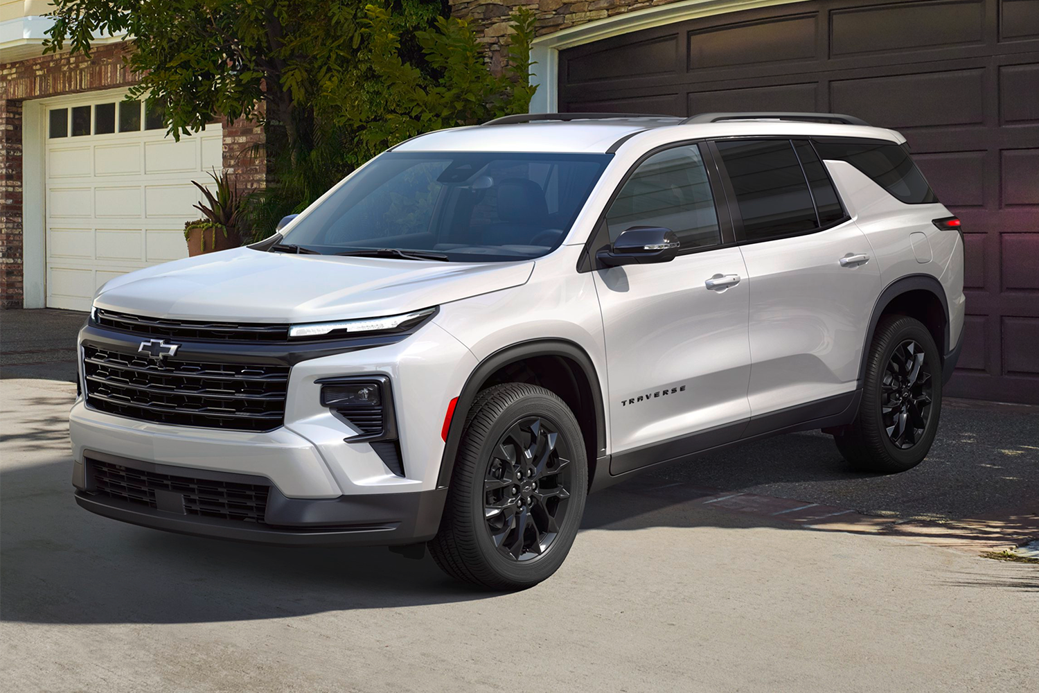 2026 Chevy Traverse Parked in Front of a Garage Door in a Suburban Neighborhood