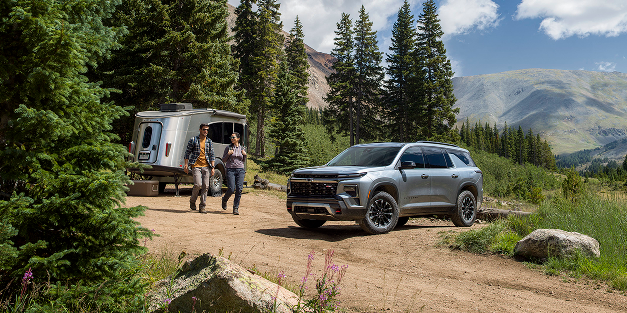 2026 chevy traverse parked at campsite with family