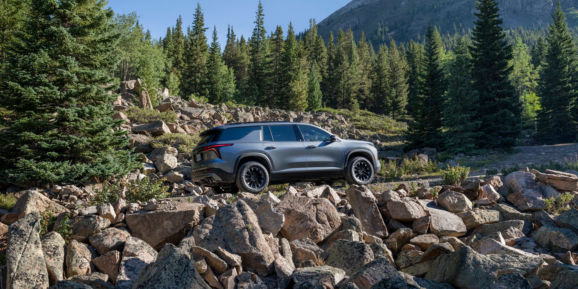 2026 Chevy Traverse Driving Off Road Up Rocky Terrain