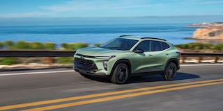 2026 Chevy Trax Speeding Over a Bridge Overlooking a Lake Below