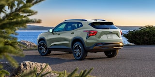 Driver's Side profile View of a 2026 Chevy Trax Parked Facing a Lake
