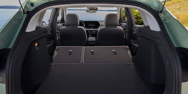 2026 Chevrolet Trax cargo area with 60/40 split-folding rear seats fully folded flat for max cargo