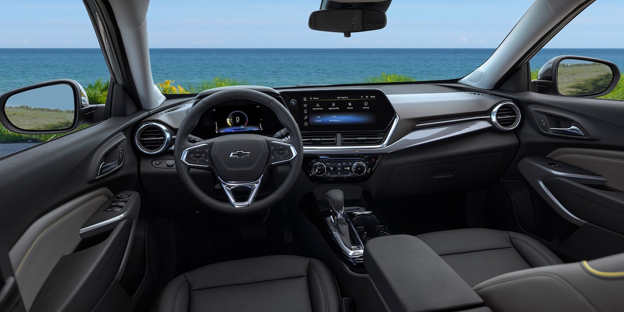 2026 Chevy Trax Interior Dashboard And View of a Lake Through the Windshield