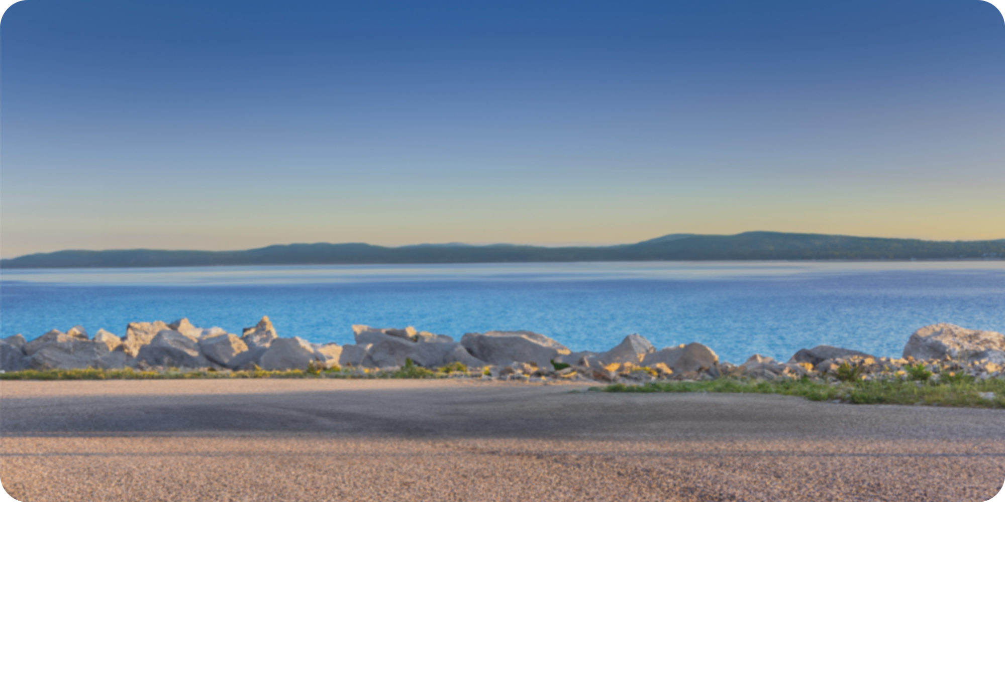 Lake Shore with Mountains in the Background