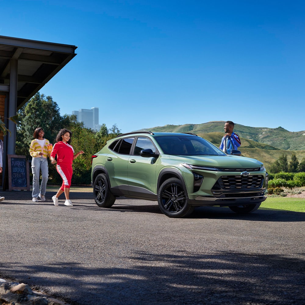 A Group of Friends Walking Toward Their Parked 2026 Chevy Trax
