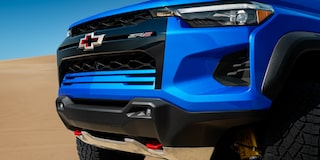 Close-up of the Front Grill of a 2026 Chevy Colorado Vehicle on a Desert