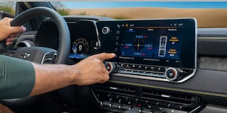 Close-up of the Display Dashboard with the Driver Selecting a Program in a 2026 Chevy Colorado