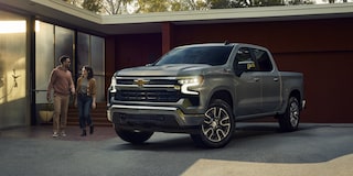 2026 Chevrolet Silverado LD parked outside a house.