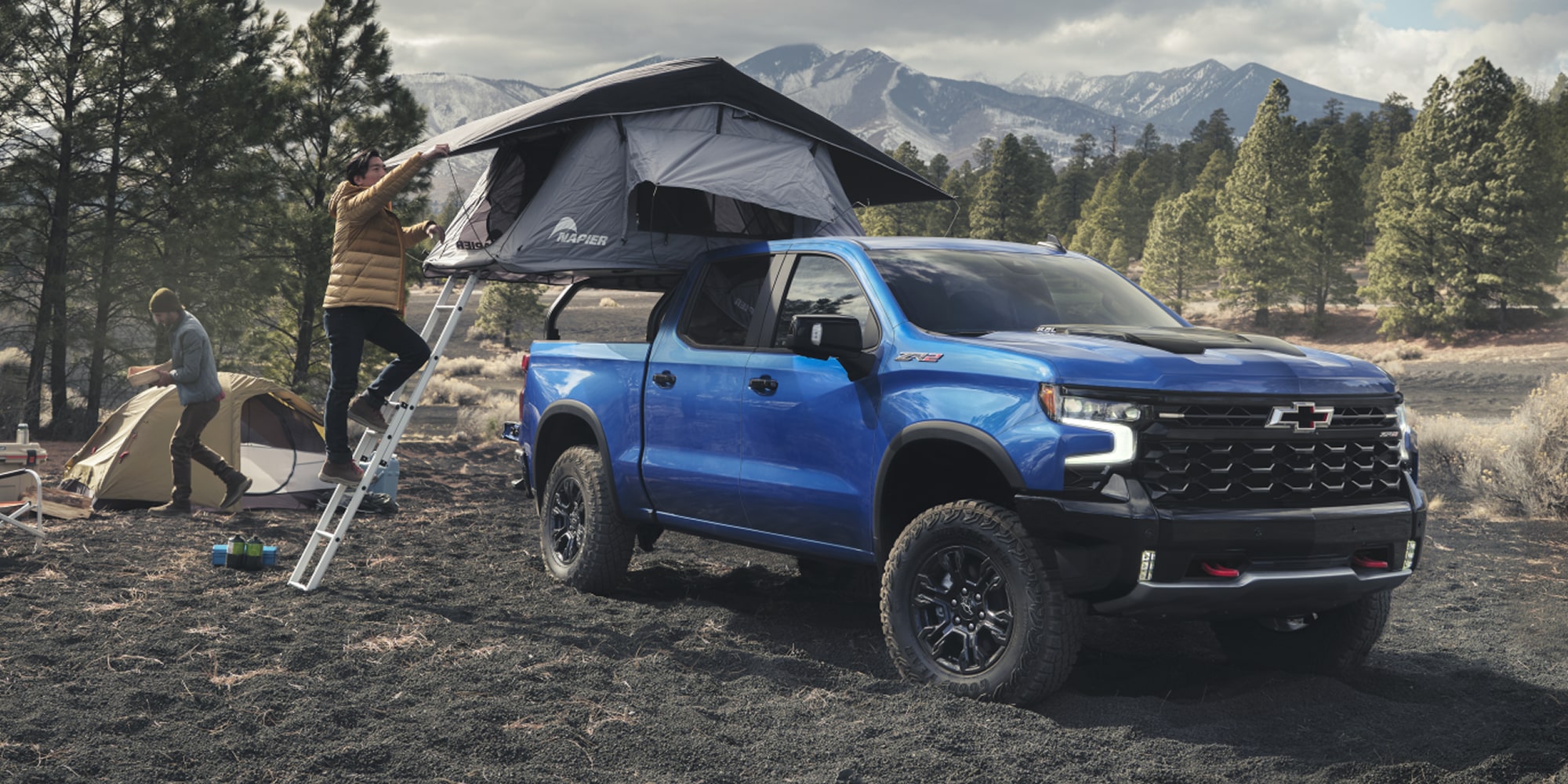 2026 Chevrolet Silverado LD Crew Cab ZR2 parked on a dirt terrain.