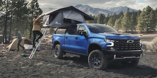 2026 Chevrolet Silverado LD Crew Cab ZR2 parked on a dirt terrain.