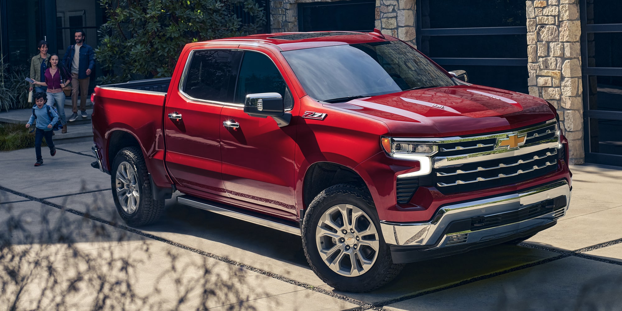 2026 Chevrolet Silverado LD Crew Cab LT parked outside a family's home.
