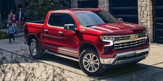 2026 Chevrolet Silverado LD Crew Cab LT parked outside a family's home.