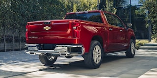 Back-side view of the 2026 Chevrolet Silverado LD Crew Cab LT parked outdoors.