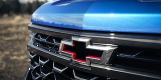 Close up view of the Chevrolet logo on the front grille of the 2026 Chevrolet Silverado LD Crew Cab ZR2.