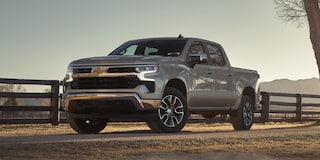 Front-side view of the 2026 Chevrolet Silverado LD Crew Cab LT parked outdoors on a sunny day.