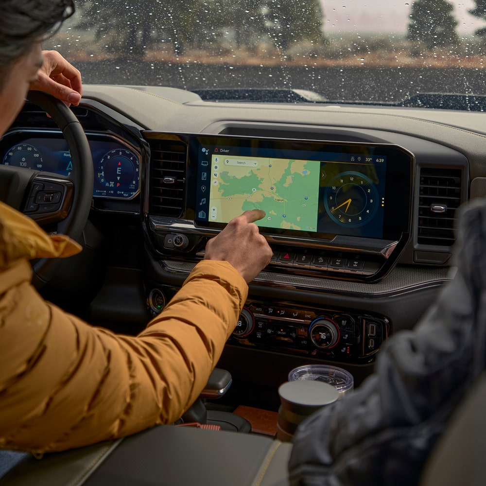 Two people seated at the front row of the 2026 Chevrolet Silverado LD.