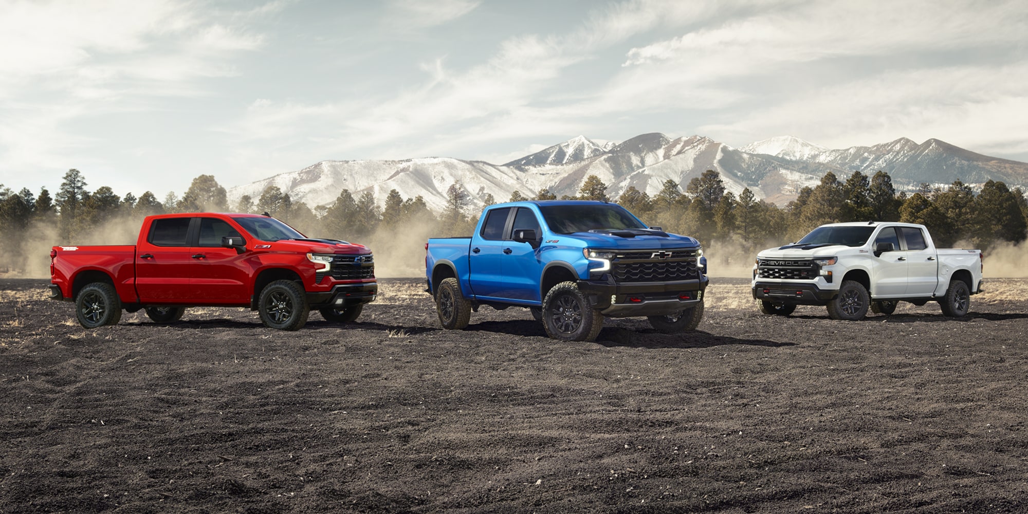 2026 Chevrolet Silverado 1500 driving across rugged terrain