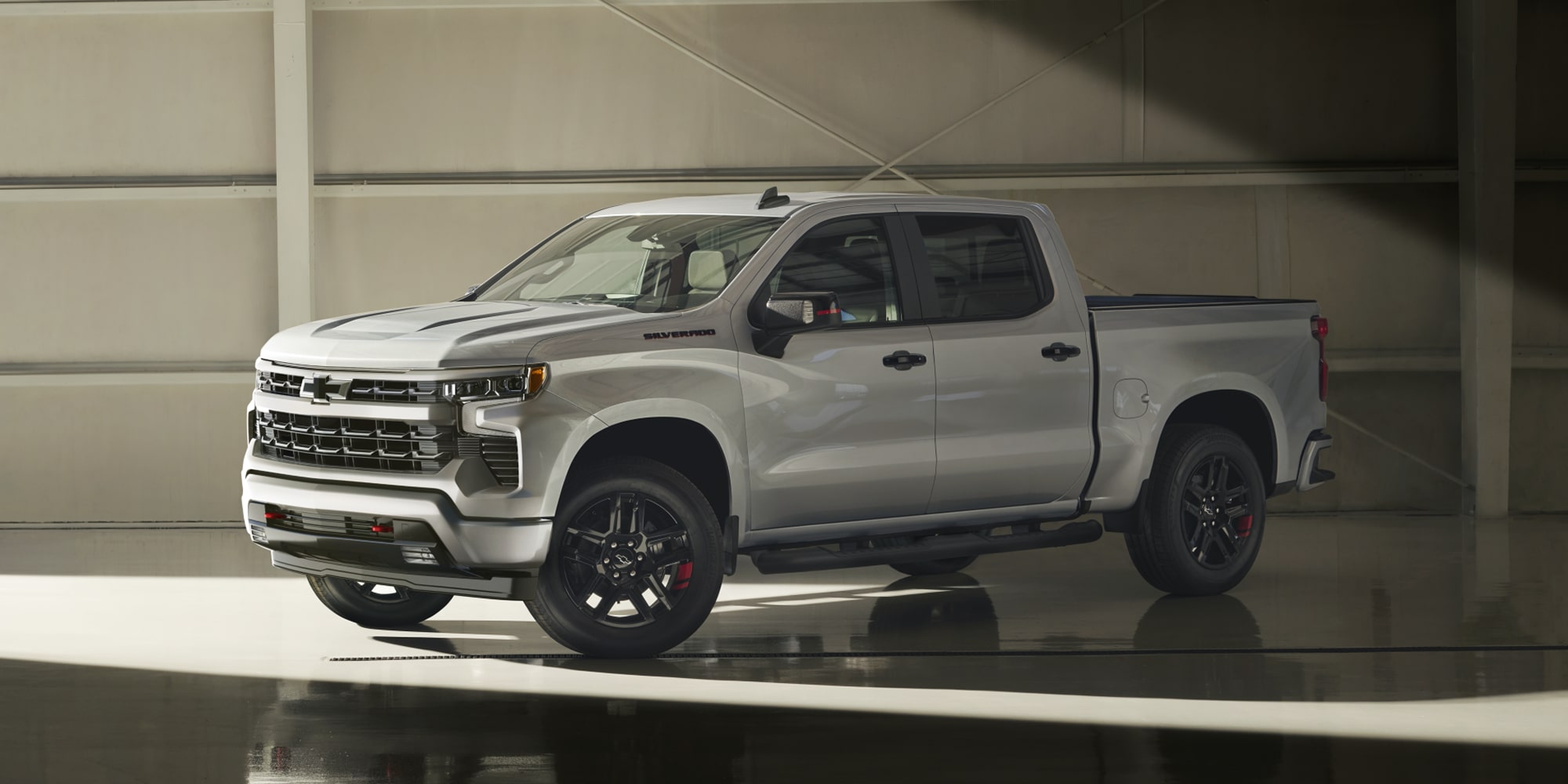 2026 Chevy Silverado Side Profile Parked in a Warehouse