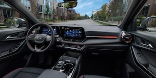 Close-up of the Display Dashboard with the Driver Selecting a Program in a 2026 Chevy Colorado