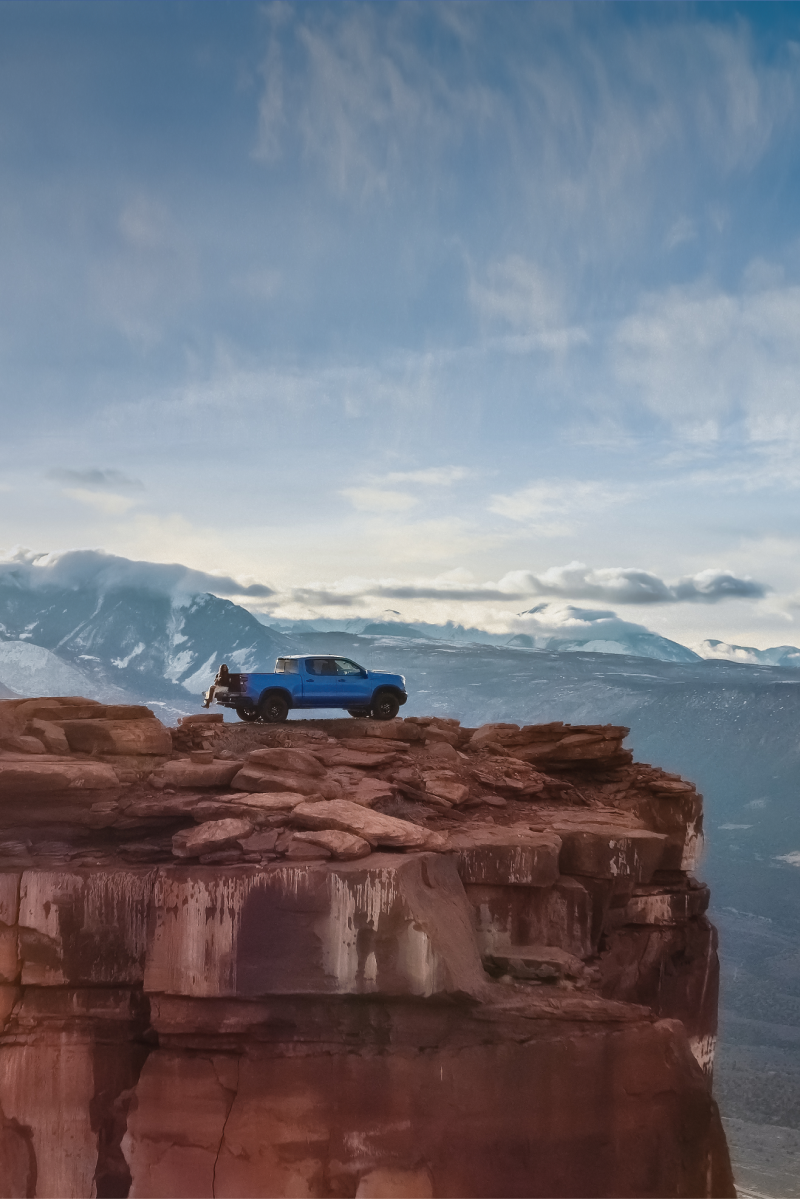 A Blue Chevrolet Silverado 1500 Truck on Top of Castle Rock in Utah.