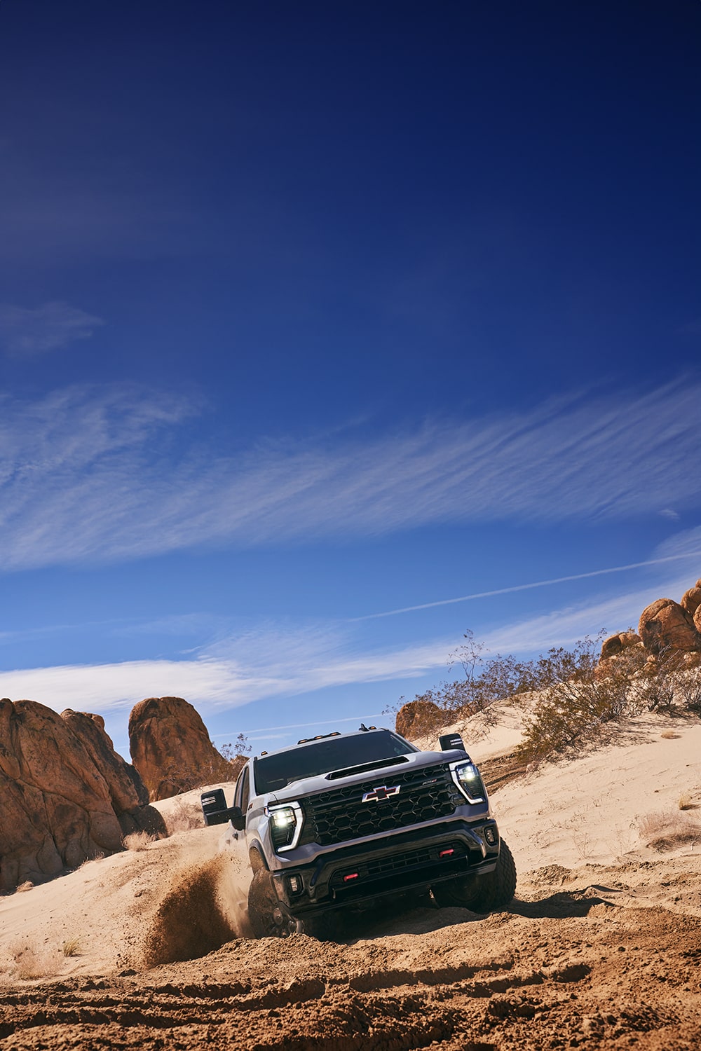 Front View of a Chevy Silverado HD Drifting in a Desert