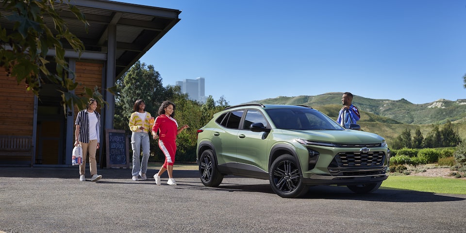 Group of Friends Approaching a 2024 Chevy Trax