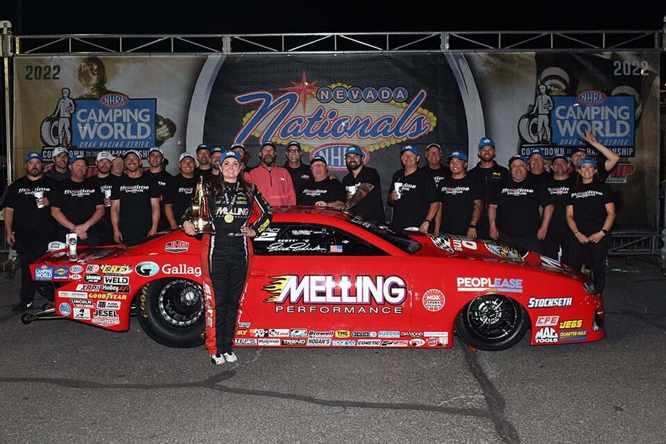 Enders celebrates with her team in the Las Vegas winner's circle.