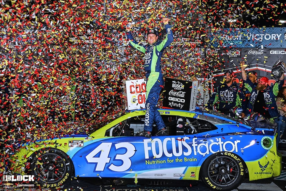 Jones celebrates with his Petty GMS and Chevrolet teammates in Victory Lane.