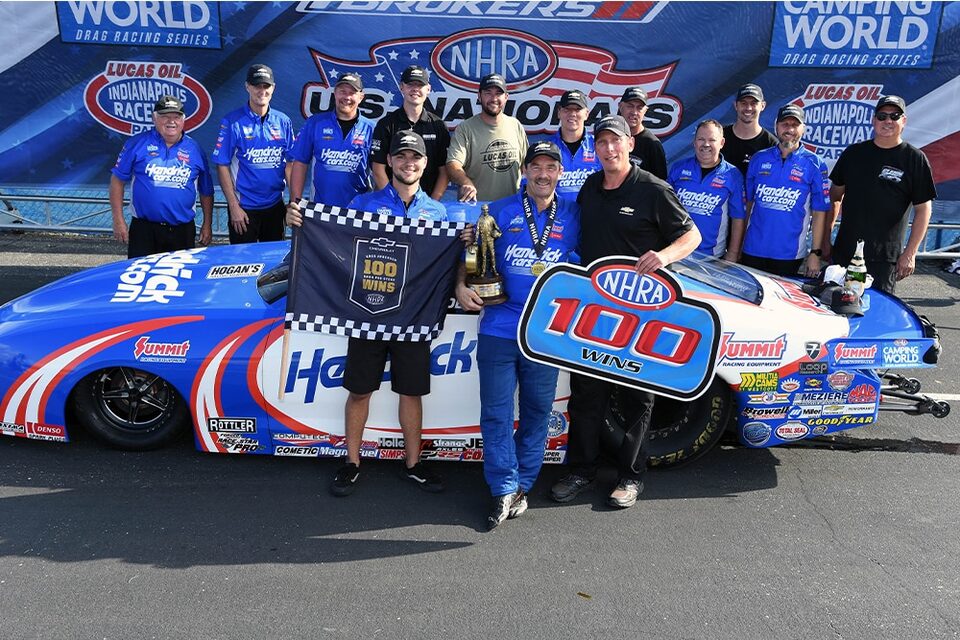 Anderson celebrates in the Lucas Oil Indianapolis Raceway Park winner's circle with his Chevrolet and KB Racing teammates.