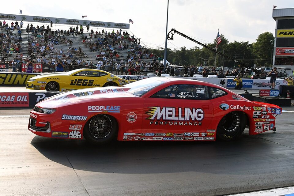 Erica Enders (near lane) defeated teammate Troy Coughlin Jr. in an all- Camaro SS Pro Stock final round at Maple Grove.