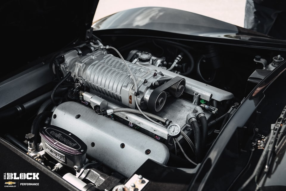 The Corvette features a supercharged LS1 engine under the hood.