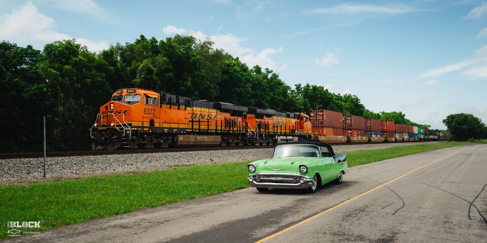 The 1957 Chevrolet Convertible in Bowling Green Driving Next to a Train