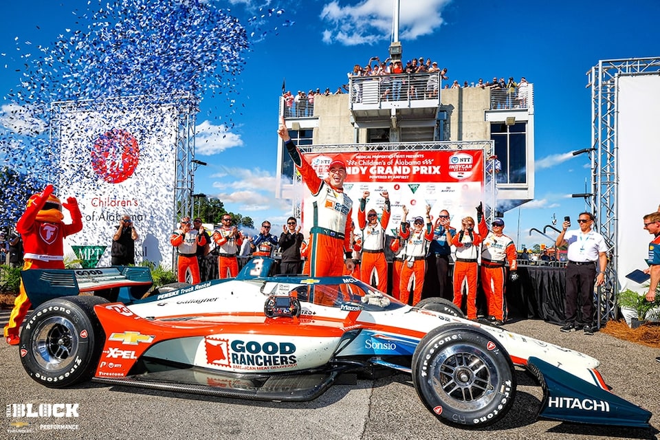 McLaughlin celebrates with his team in Victory Lane.