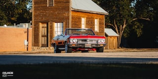 Wide Front Three-Quarter View of a 1966 Chevrolet Chevelle SS Convertible Parked in an Empty Parking Lot