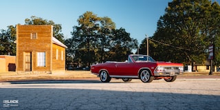 Wide Front Side View of a 1966 Chevrolet Chevelle SS Convertible Parked in an Empty Parking Lot