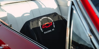 Close-up of "Piedmont Classic Chevy Club" Seat Cover in a 1966 Chevrolet Chevelle SS Convertible Parked in an Empty Parking Lot
