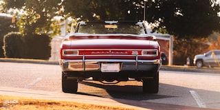 Back View of a 1966 Chevrolet Chevelle SS Convertible Parked in an Empty Parking Lot